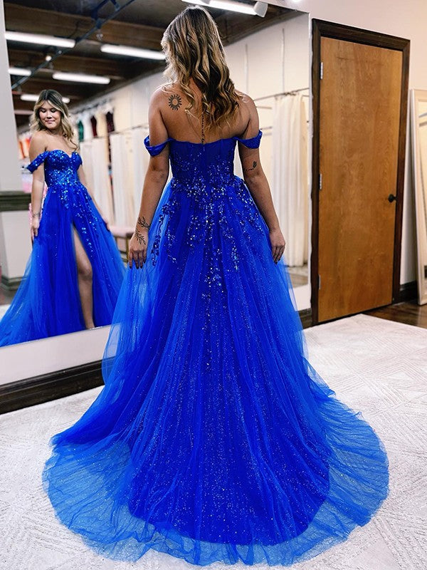Side view of the A-line prom dress, highlighting the sweep train and appliques.