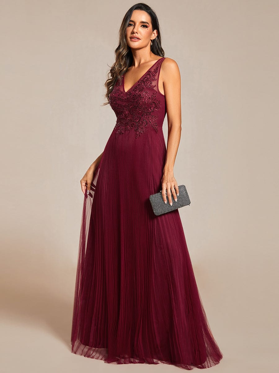 Model wearing a blue A-line tulle evening dress, perfect for formal events.