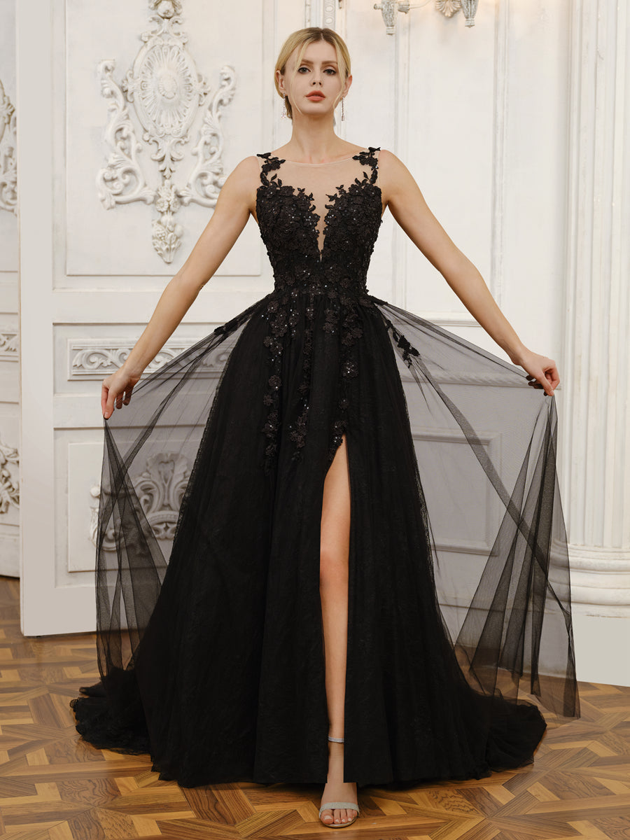 Full length view of the bride in a sleeveless tulle wedding dress with a dramatic split.
