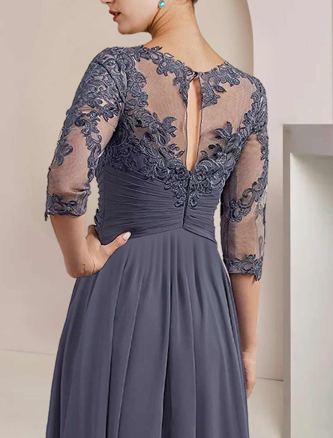 Side view of the tea length A-Line mother of the bride dress.