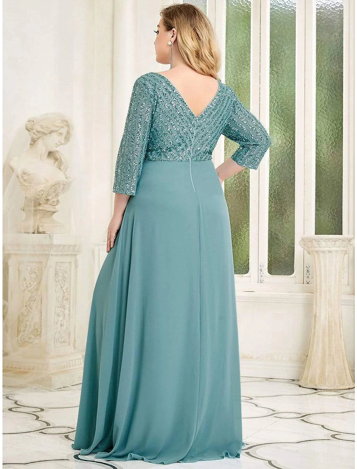 Side view of a plus size chiffon gown, showcasing sequin details.