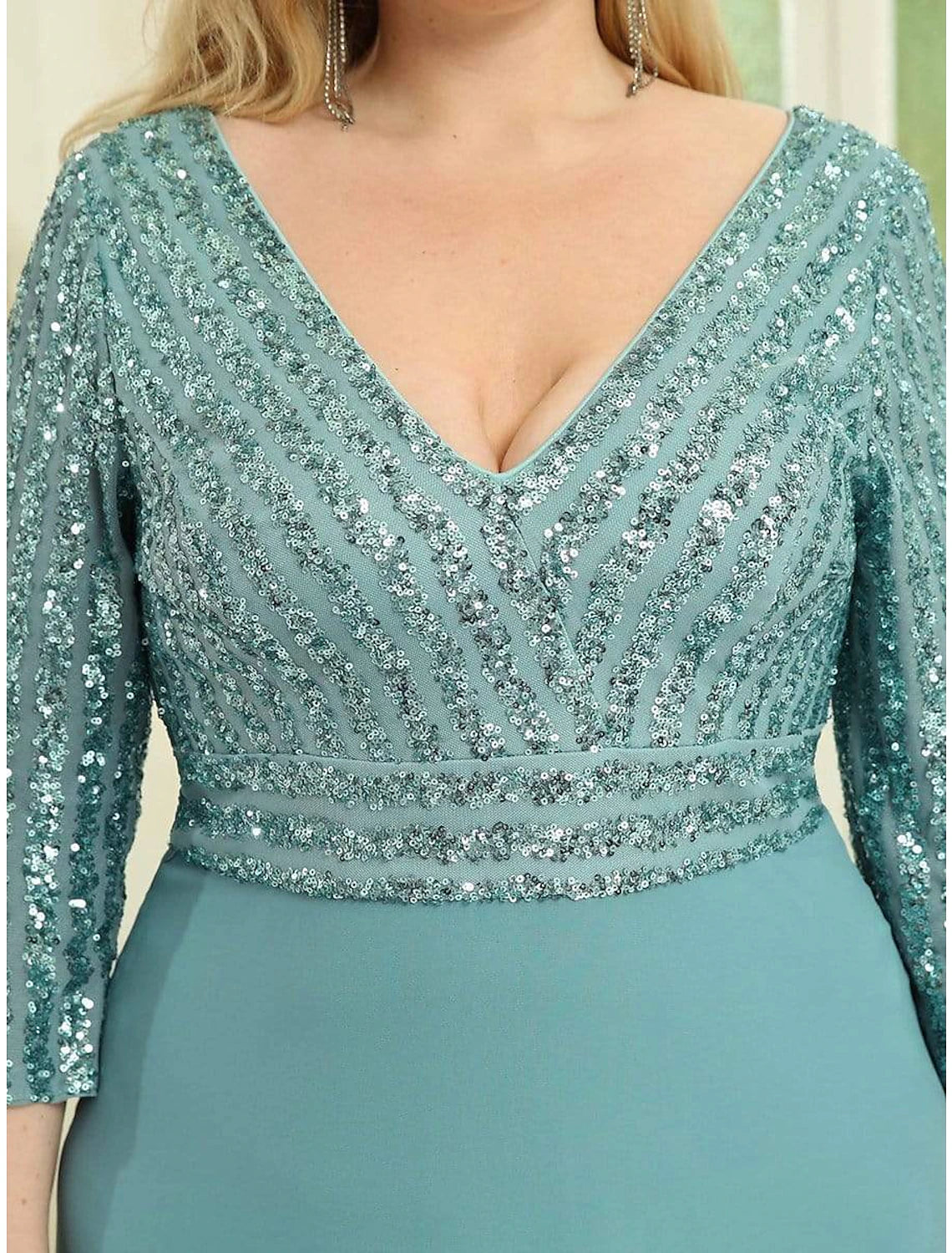 Back view of a floor-length V-back evening dress.