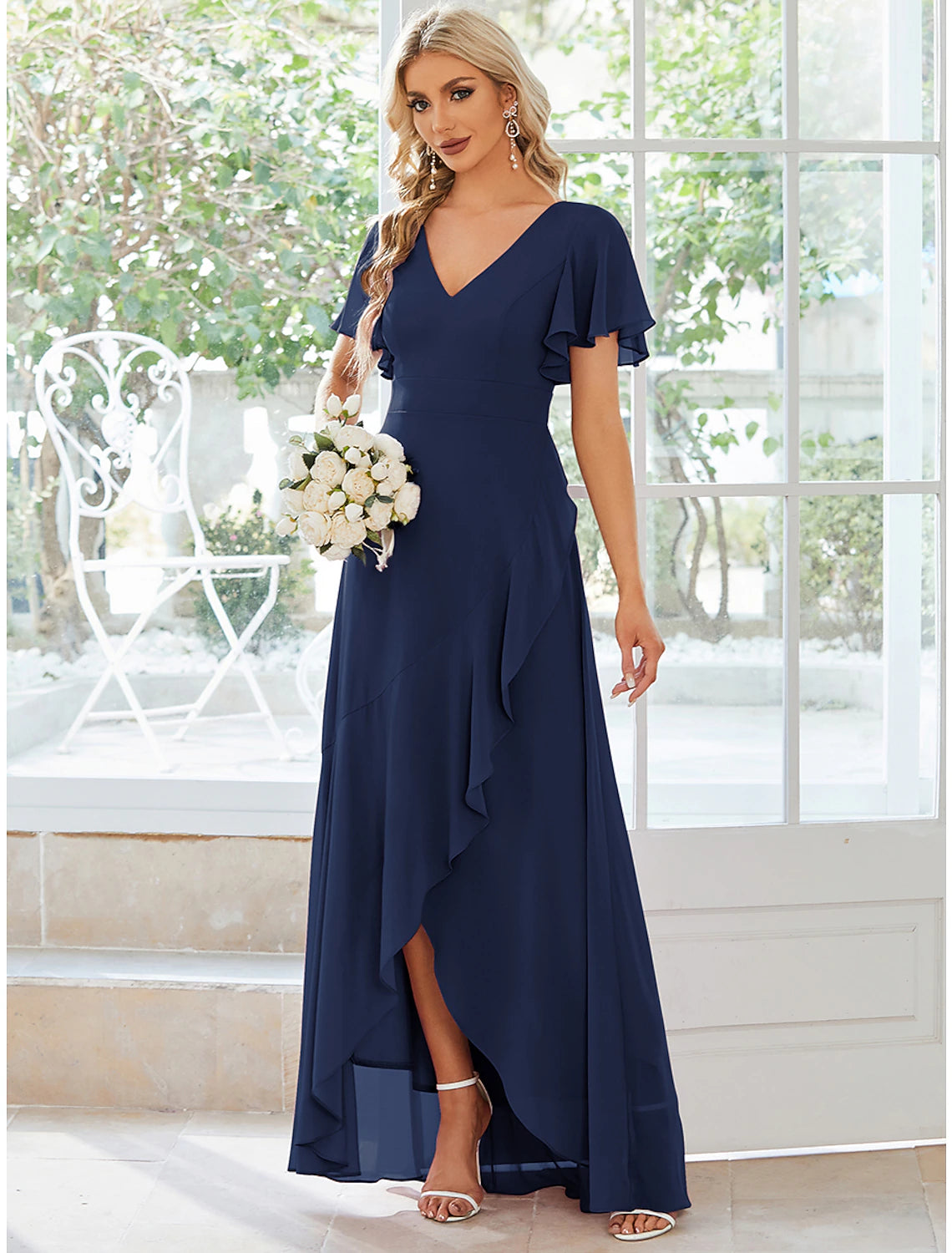 Full view of the back of the solid color A-line dress, highlighting the flow of the chiffon fabric.