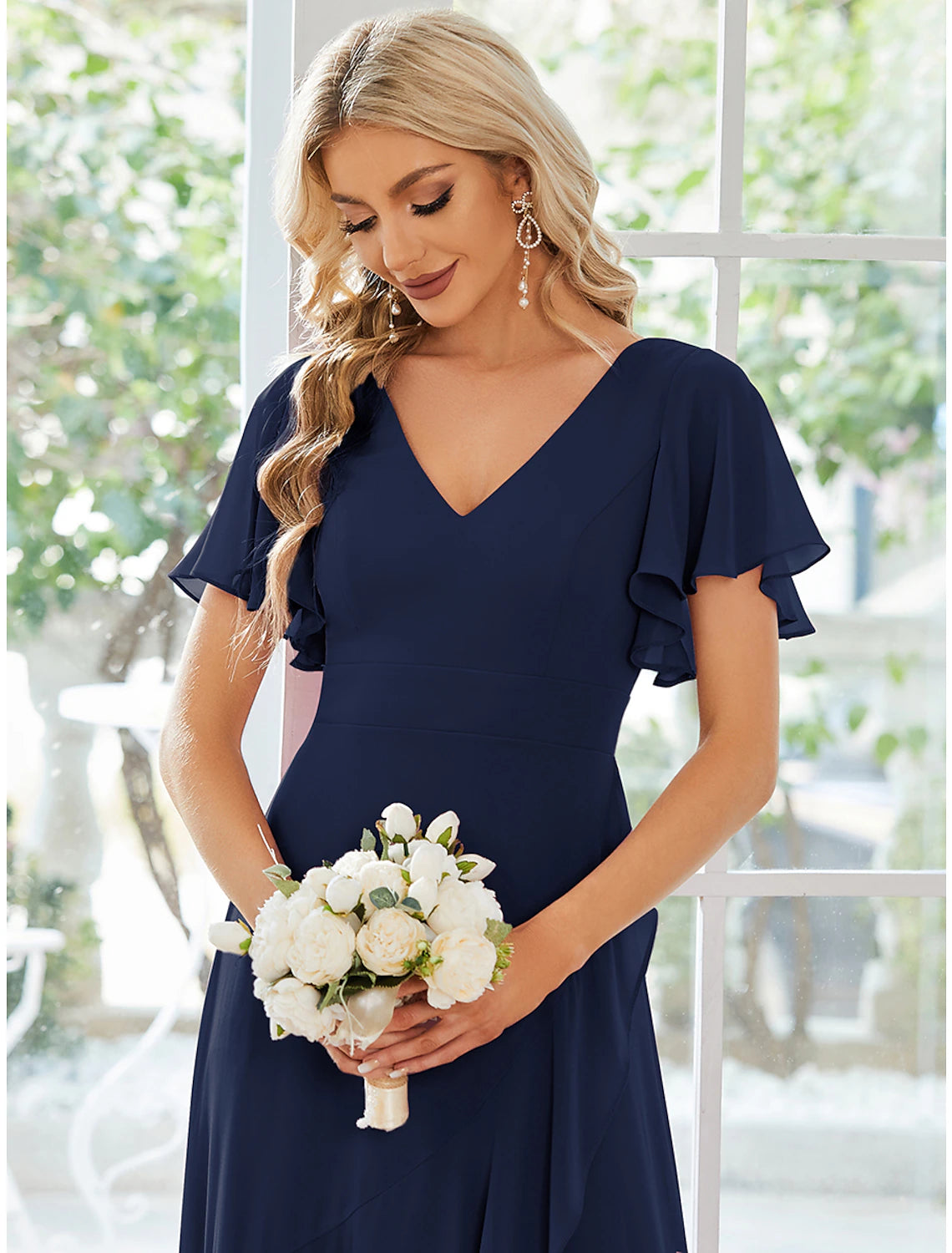 Model walking in the A-line V-neck chiffon dress, showcasing its movement and elegant drape.
