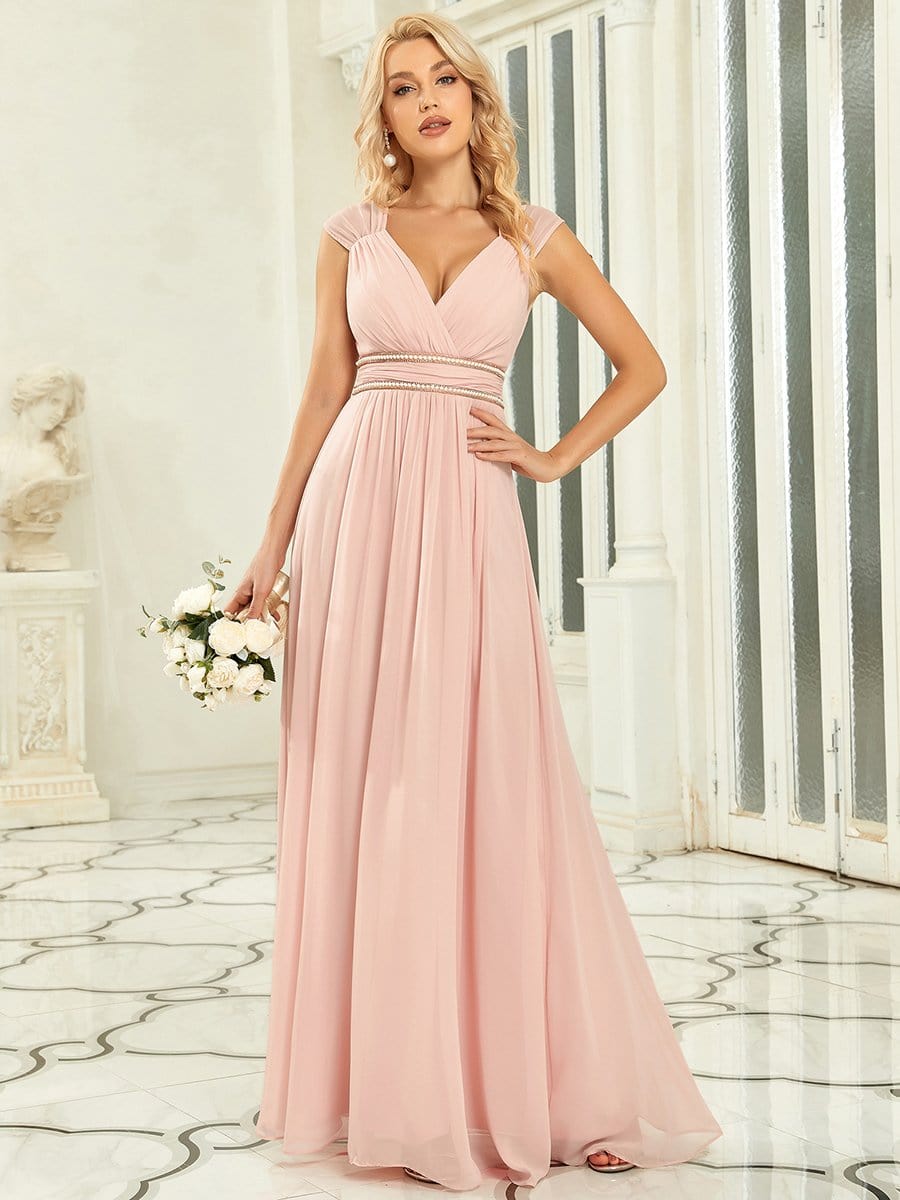 Pink A-line V-neck chiffon evening dress with beaded belt.