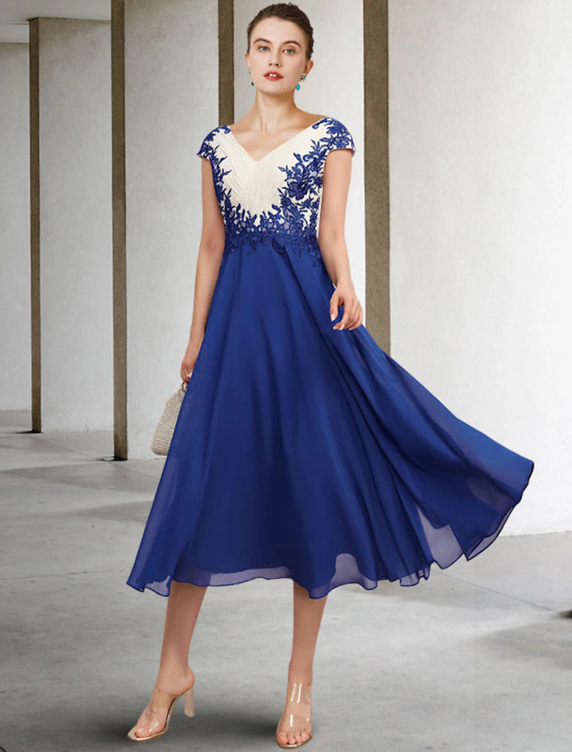 Elegant A-line V-neck cap sleeve Mother of the Bride dress with appliques and color block design.