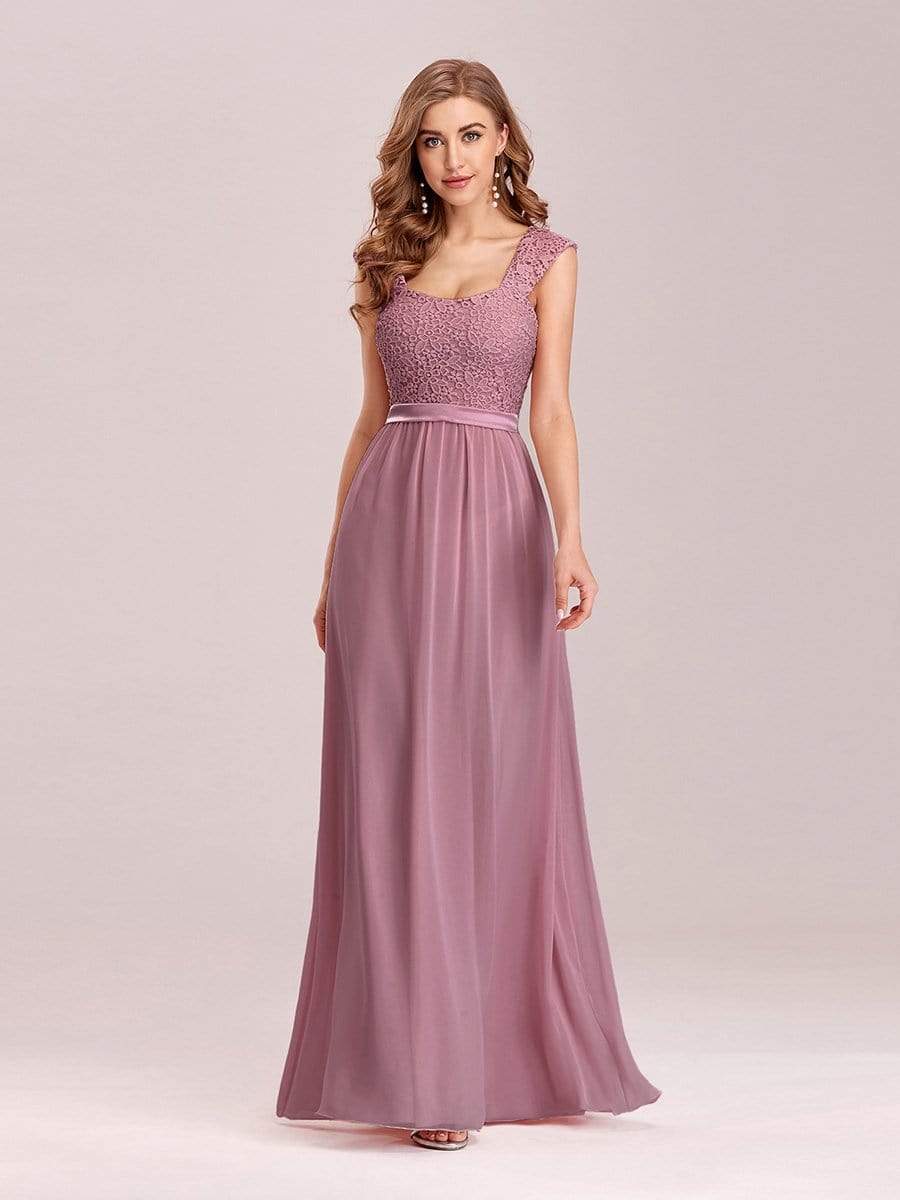 Model wearing an olive green A-line chiffon bridesmaid dress.