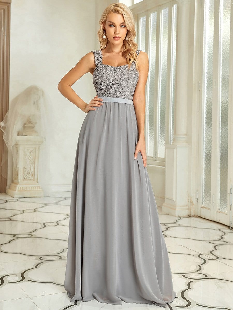 Model wearing a grey A-line chiffon bridesmaid dress.