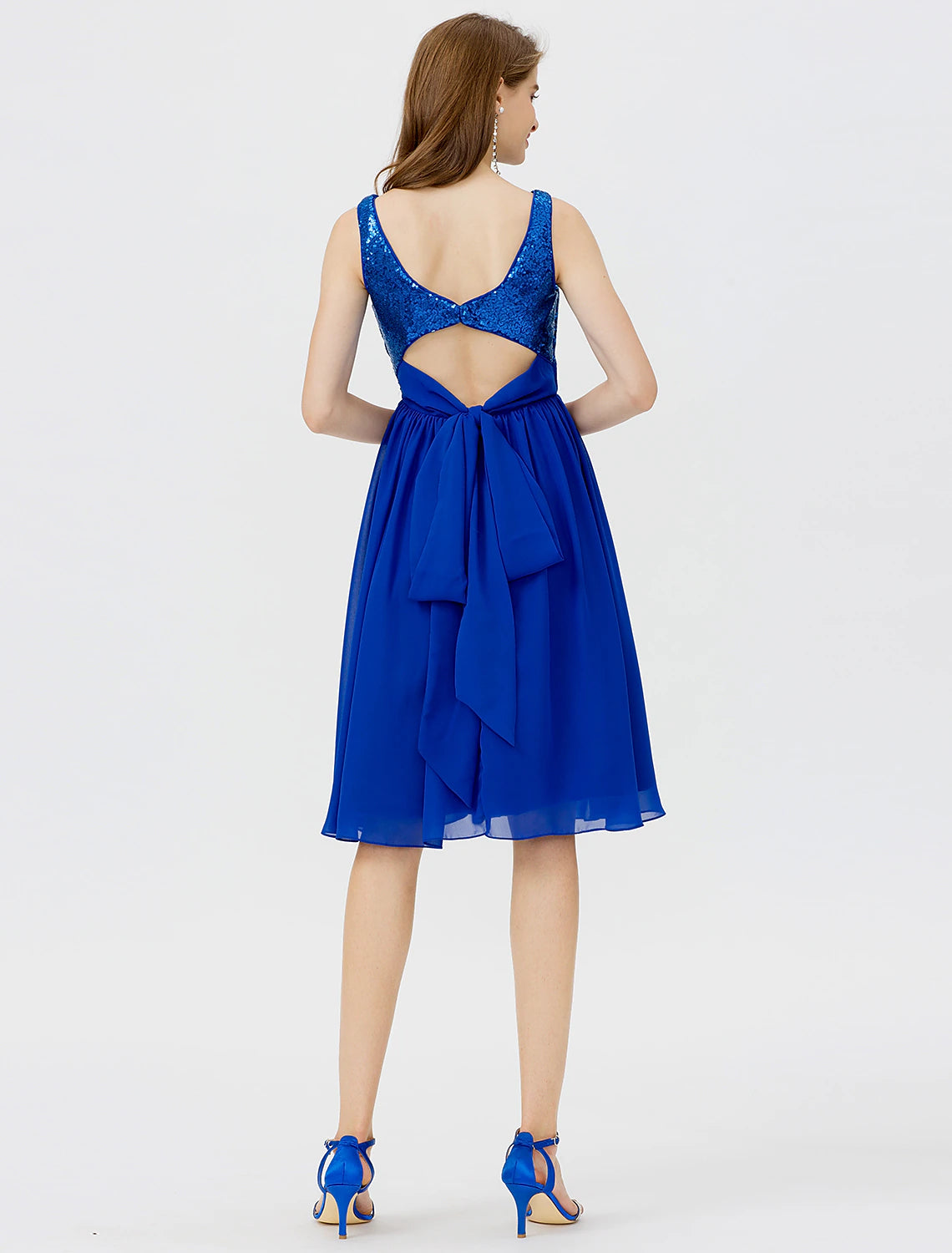 Model posing in a sleeveless Weitese A-line cocktail dress.