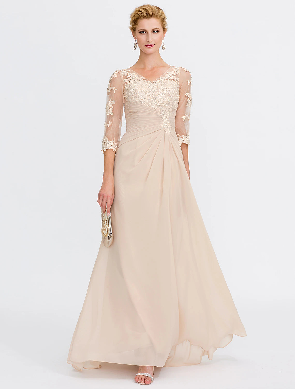 Woman wearing an elegant A-line V-neck chiffon Mother of the Bride dress with appliques and side draping.