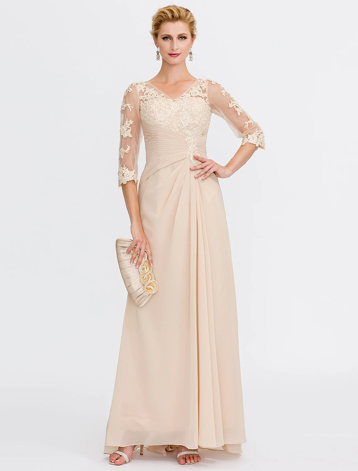 Close-up of the V-neck bodice with sheer half sleeves and delicate appliques.