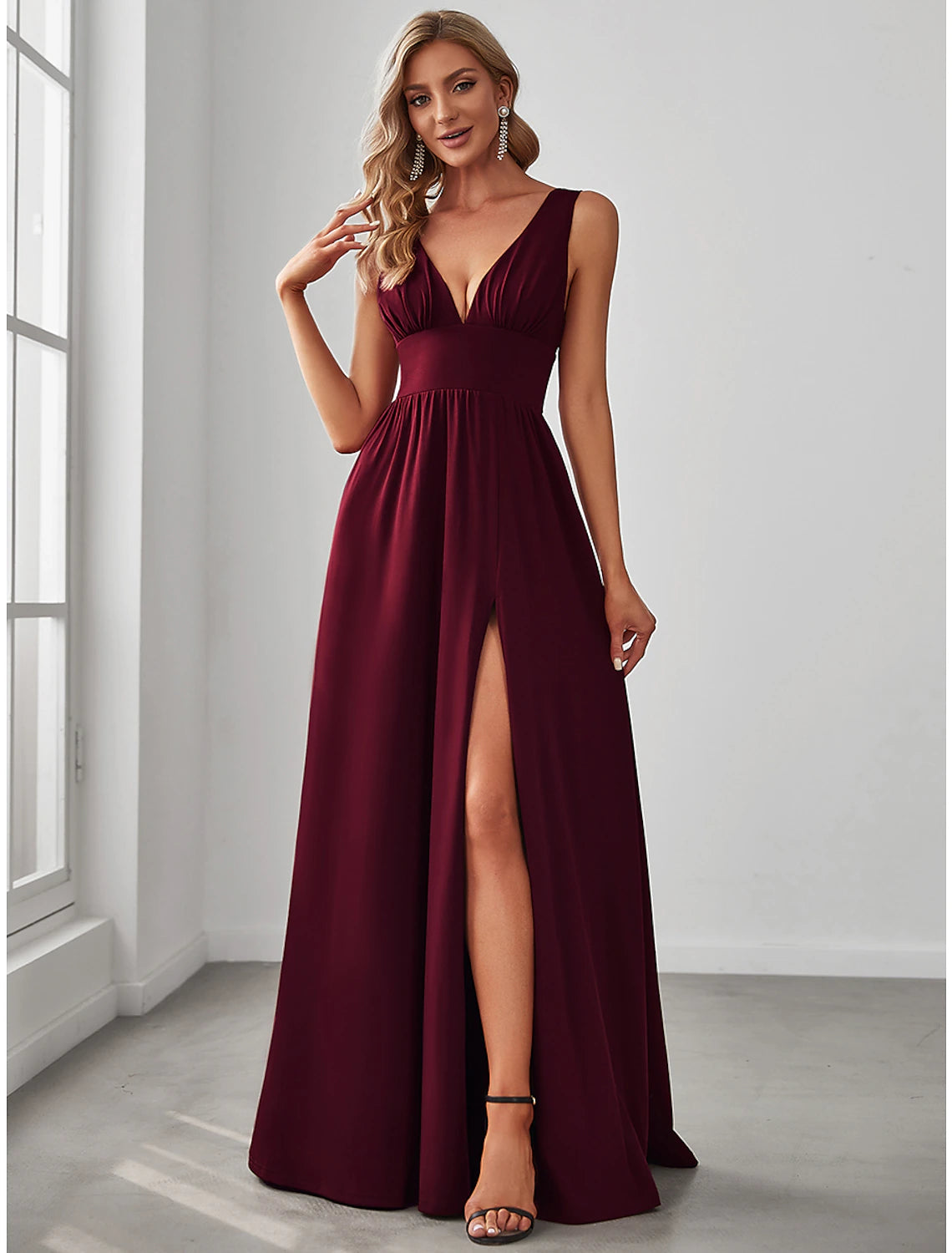 Woman walking, showcasing the high slit of an A-line V-neck chiffon gown.