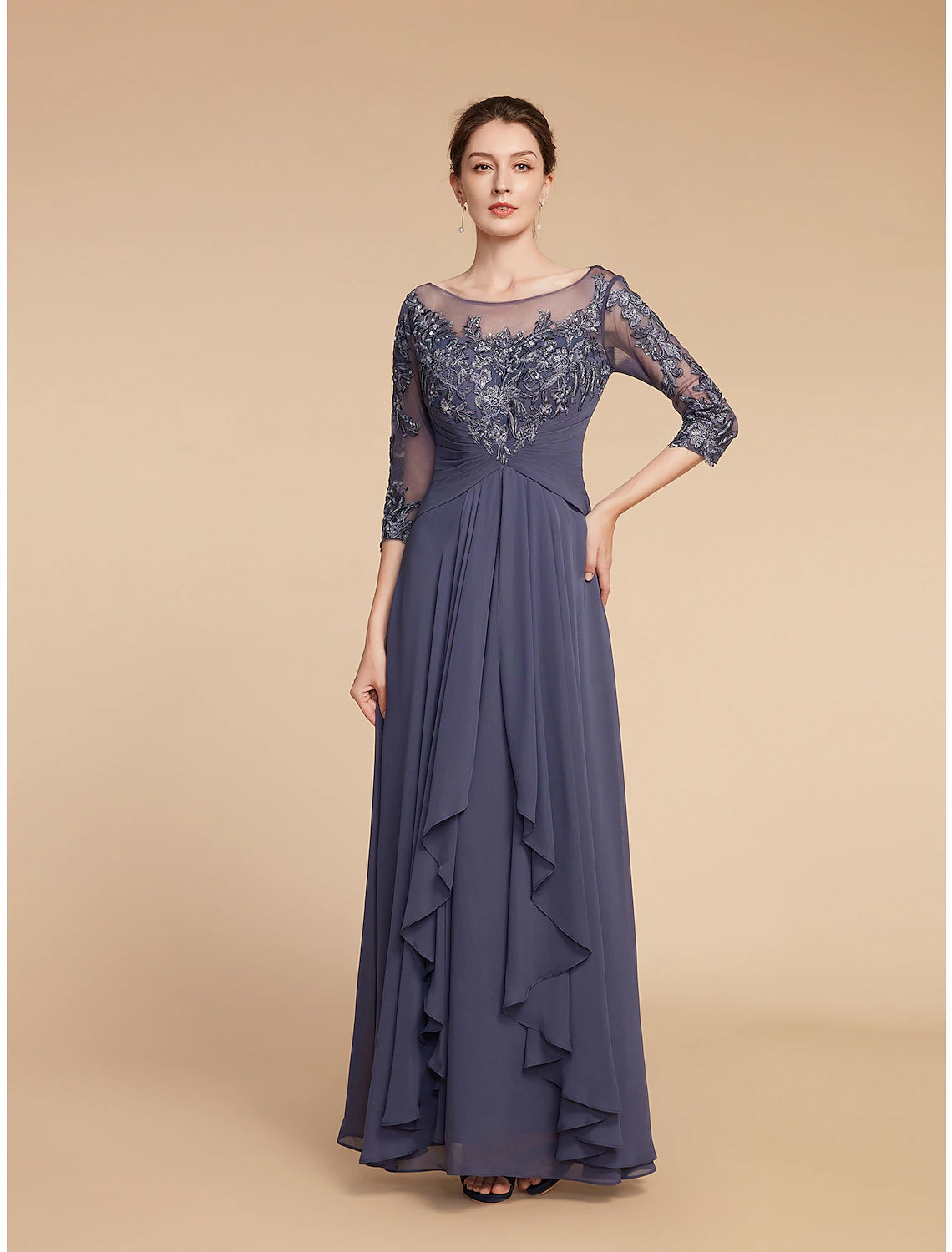 Detailed view of the chiffon and lace fabric with appliques on the 3/4 sleeve dress.