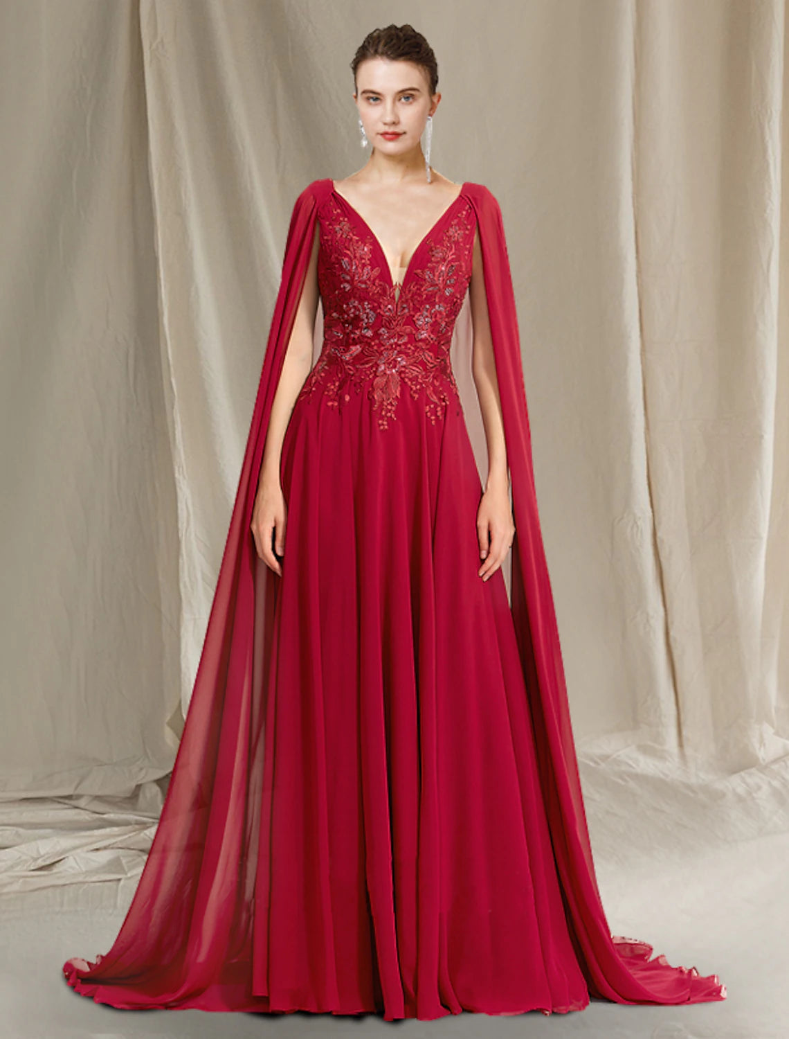 Elegant A-Line V-neck Mother of the Bride dress with pleats and sequin appliques.