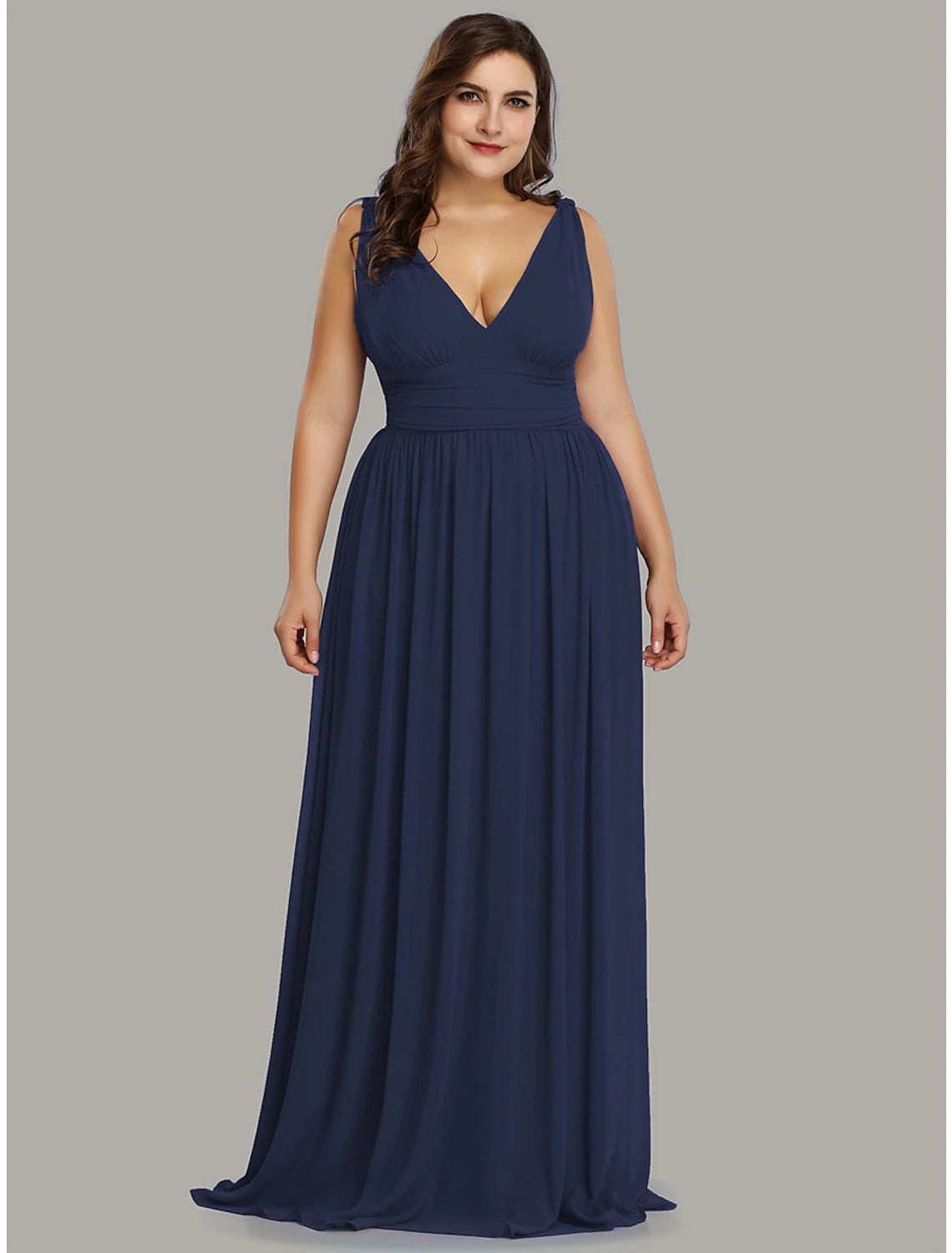 Full length view of the A-line pleated chiffon gown on a model.