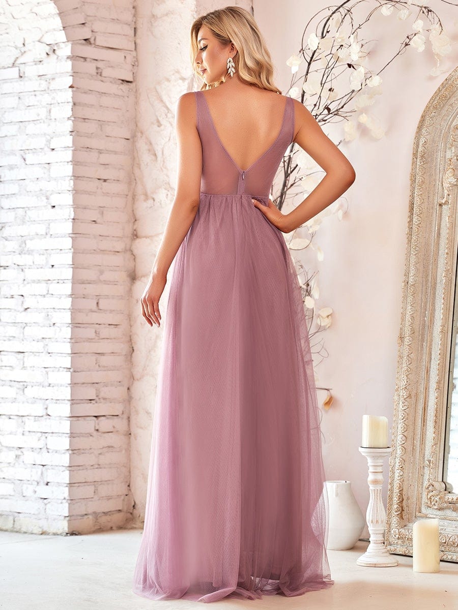 Model wearing a light blue A-line V-neck floral lace bridesmaid dress.
