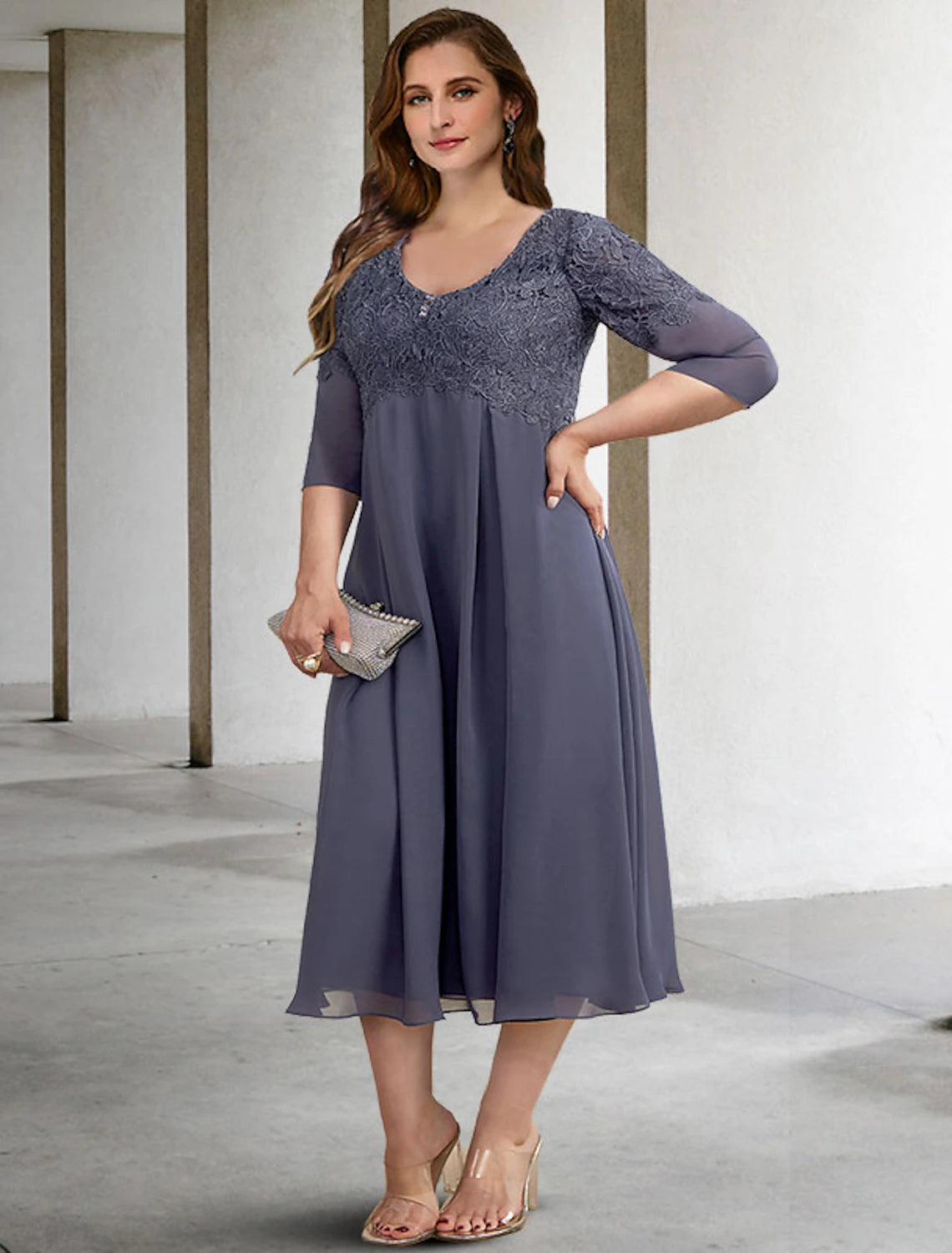 Close-up of the V-neckline and half sleeves of the elegant chiffon dress.