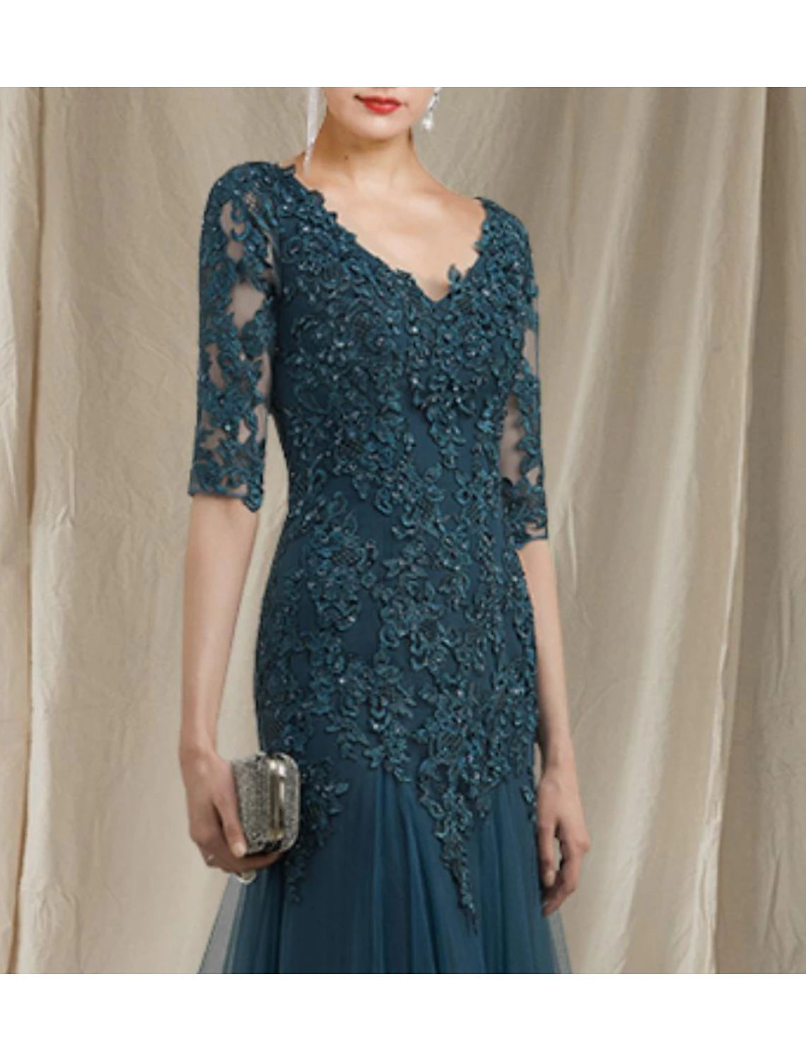 Back view of the A-Line gown showing sweep train and ruffles.