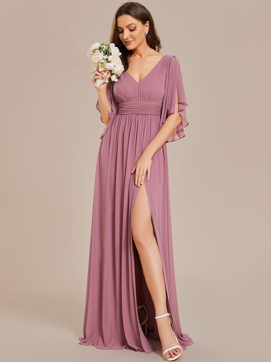 Model in a different pose, showcasing the flow and slit of the green A-line chiffon bridesmaid dress.