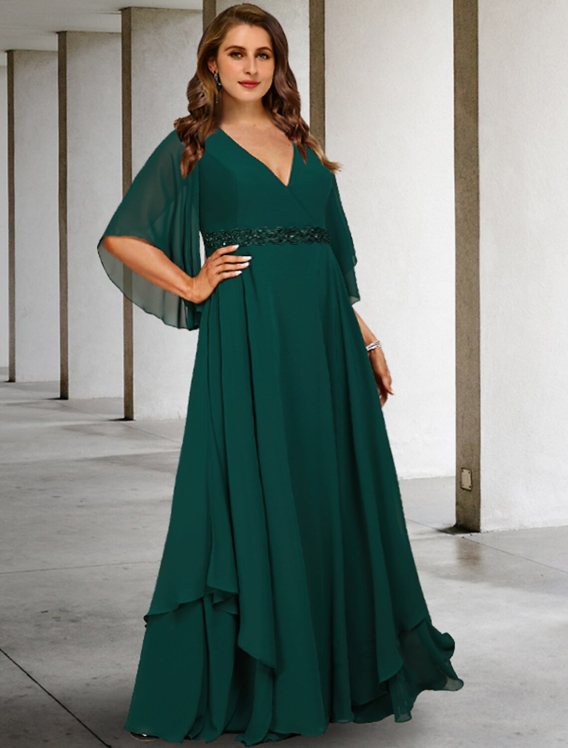 Woman wearing an elegant Weitese A-line mother of the bride dress with V-neck and half sleeves.