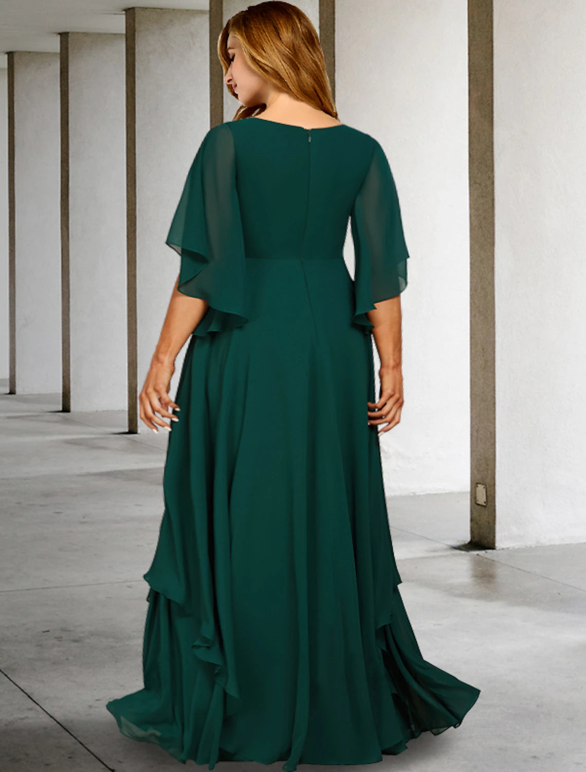 Back view of the Weitese plus size chiffon gown with sweep train and ruffles.