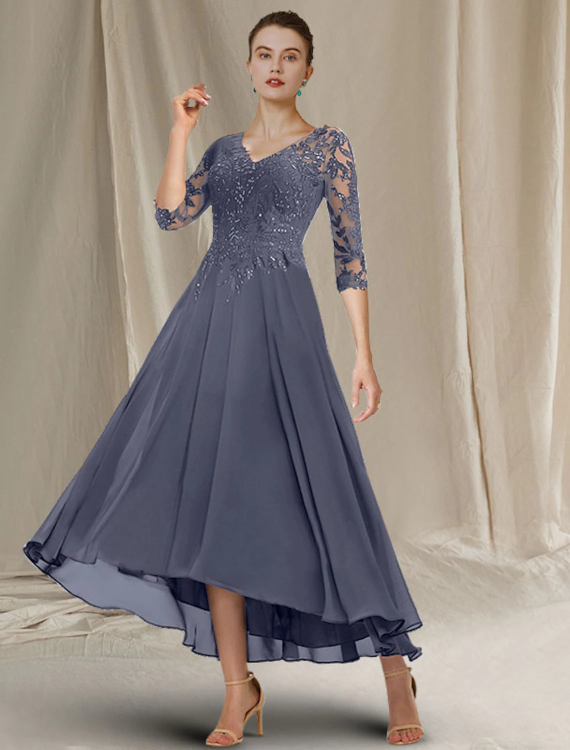 Close-up of the sequin ruffles and lace appliques on the Weitese Mother of the Bride dress.
