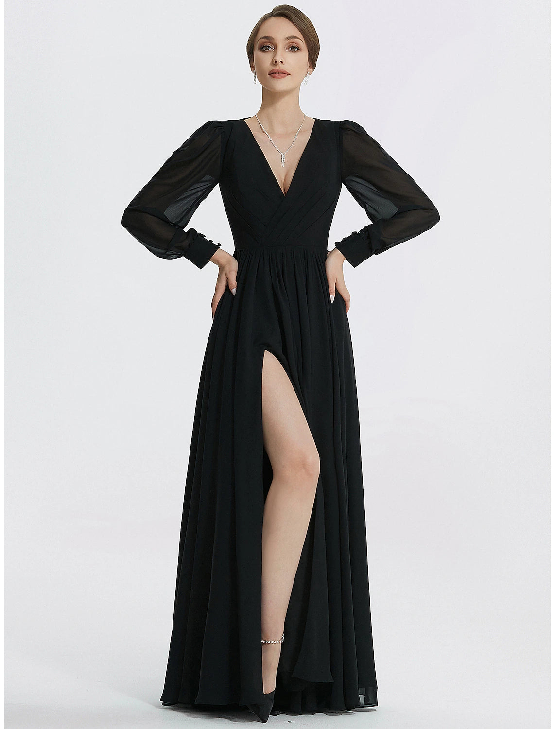 Close-up of the V-neckline and long sleeves of the evening dress.