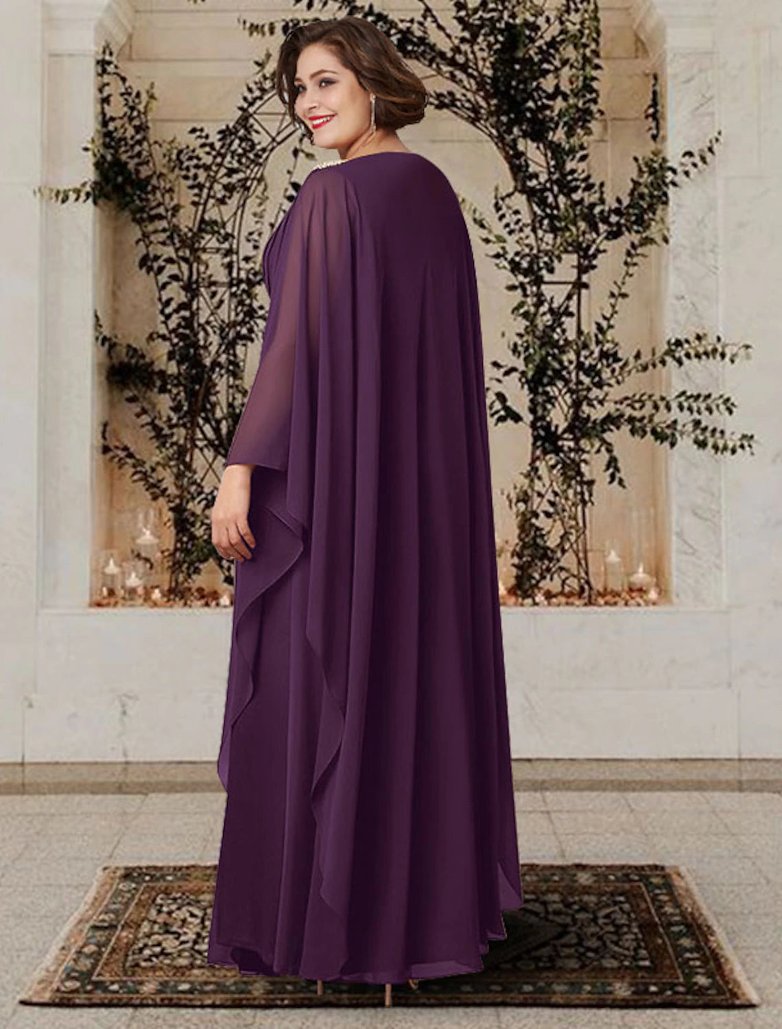 Side view of an elegant A-Line V-neck long sleeve chiffon mother of the bride dress with pleats and crystals.