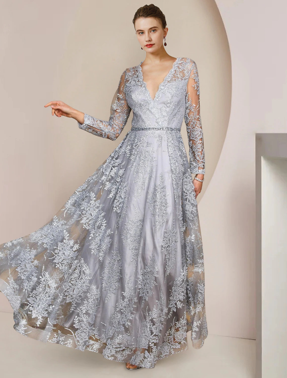 Elegant A-line V-neck long sleeve lace dress with appliques and crystal brooch.