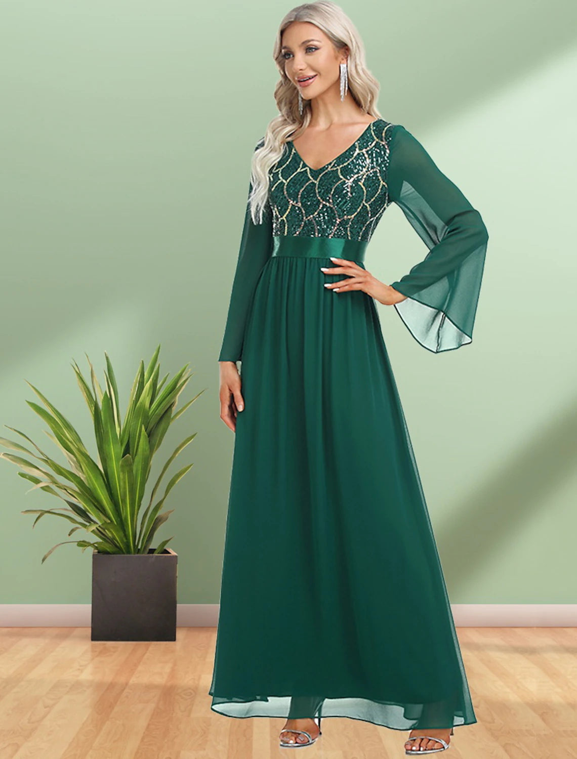 Close-up of the sequin and chiffon fabric on the long sleeve of the Weitese evening gown.