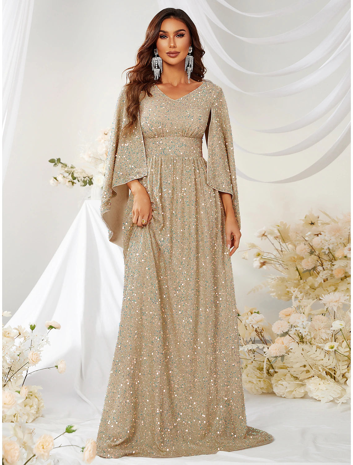 Model wearing an elegant A-line sequin evening gown with long sleeves and V-neck.