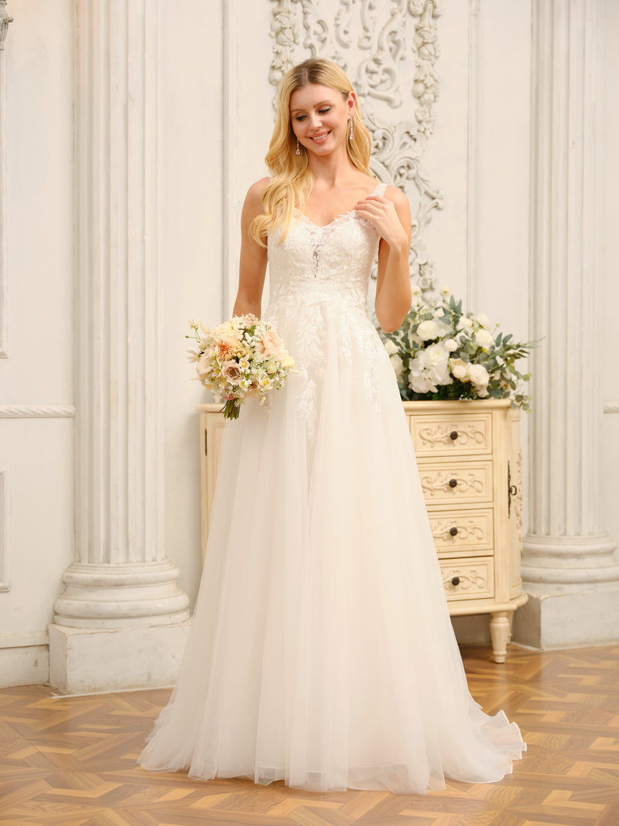 Back view of the long wedding dress with elegant train and appliques.