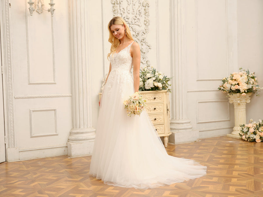 Bride posing gracefully in the Weitese A-Line wedding gown.