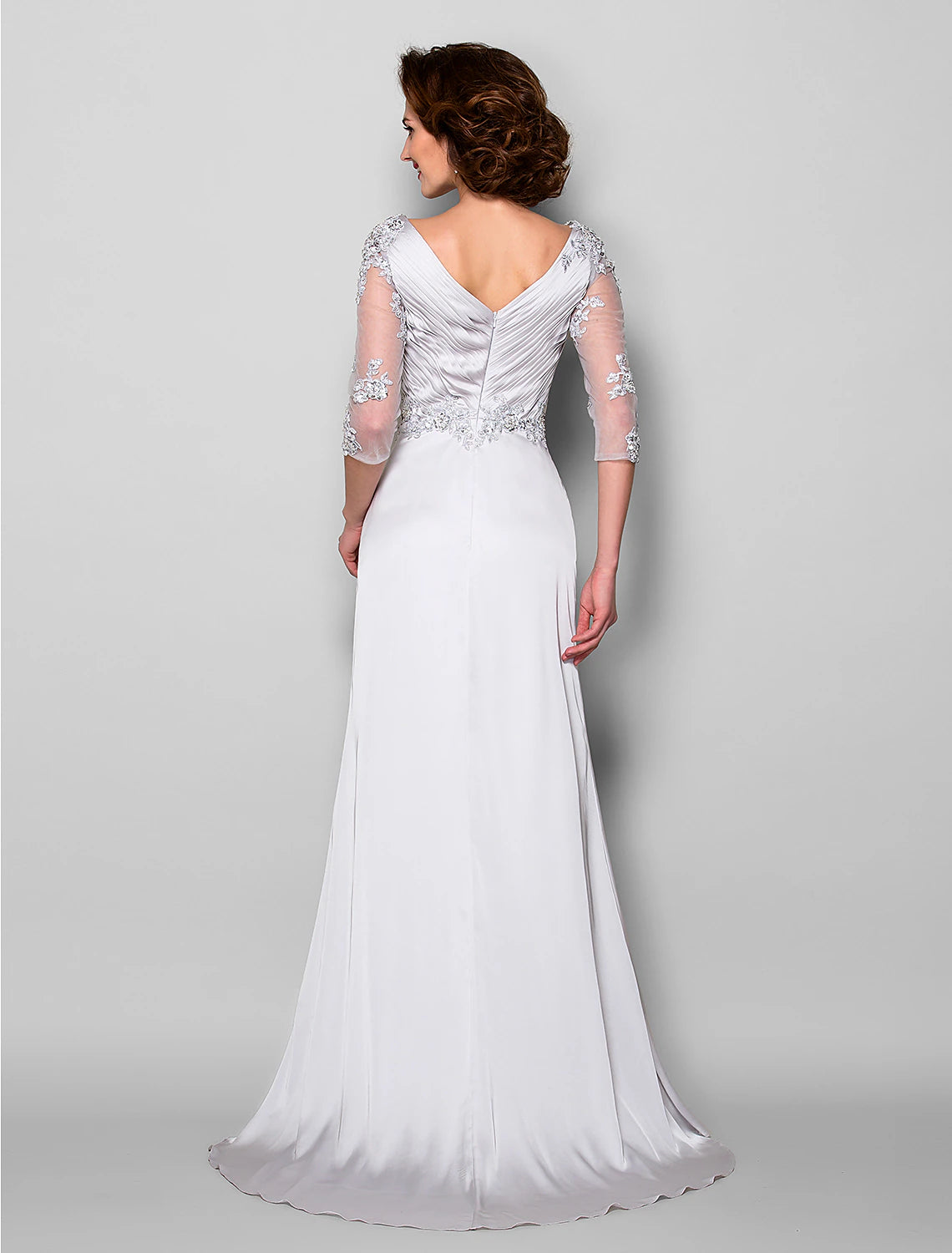 Back view of the A-line mother of the bride dress, showcasing the sweep train and criss-cross details.