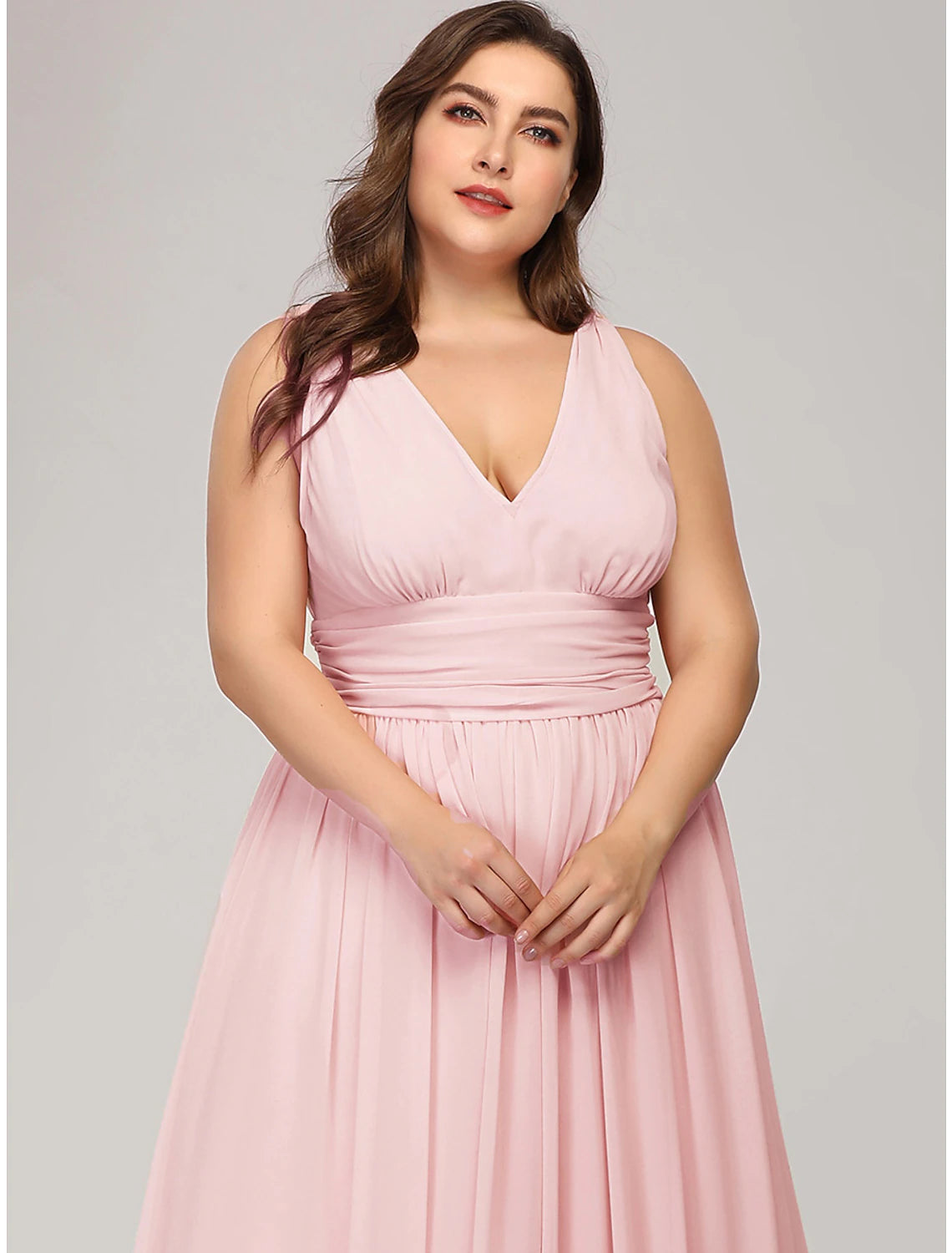 Full view of a woman posing in the elegant A-line evening gown.