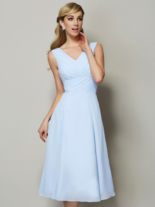 Model wearing a short A-line V-neck pleated chiffon bridesmaid dress.