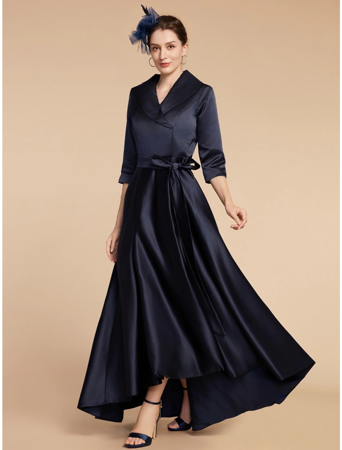 Woman wearing an elegant A-line V-neck satin dress with half sleeves and ruching.