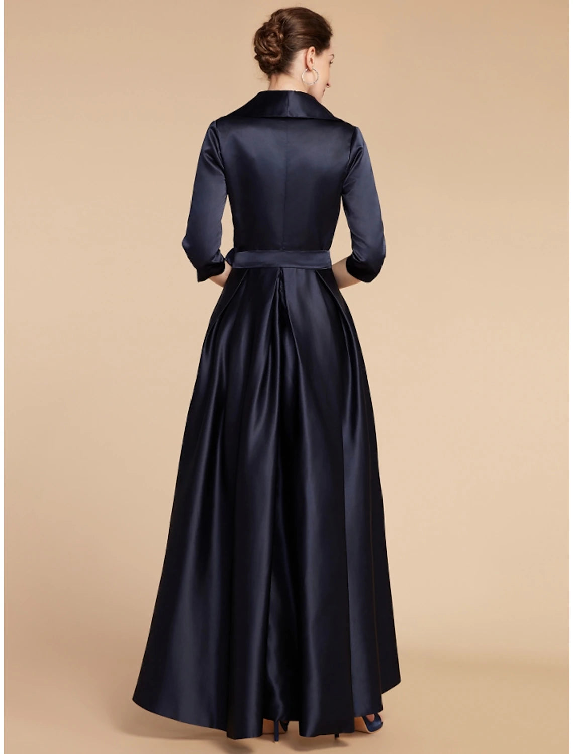Side view of the A-line satin dress, highlighting the half sleeves and sash detail.