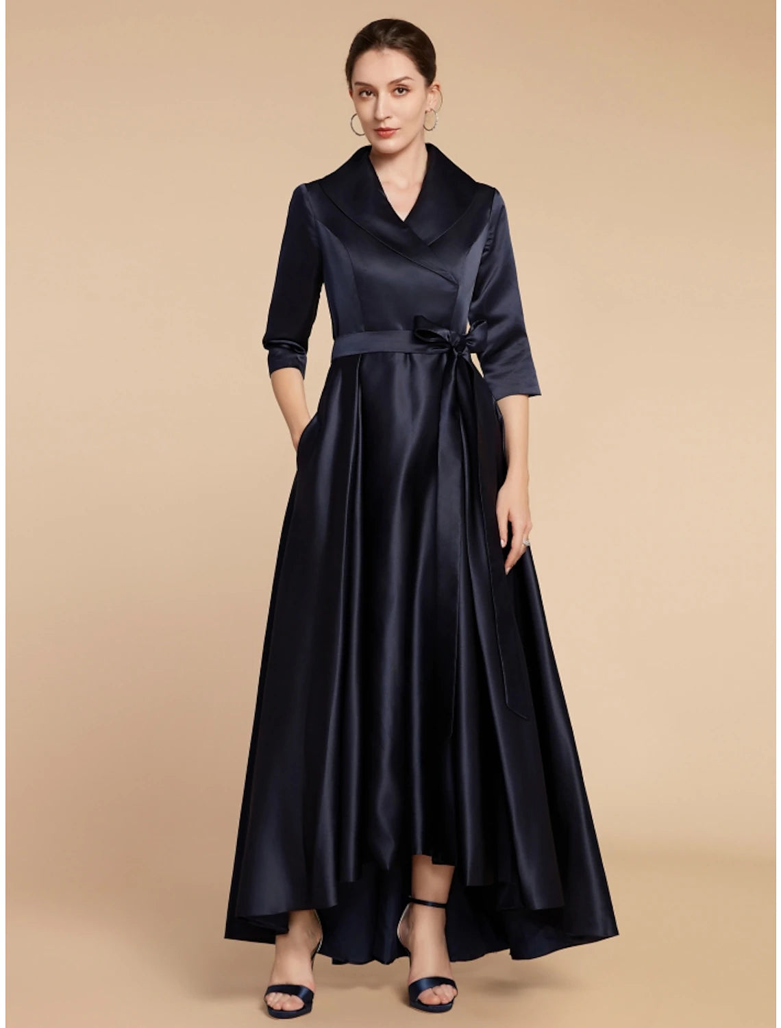 Woman posing in the sophisticated A-line mother of the bride dress.