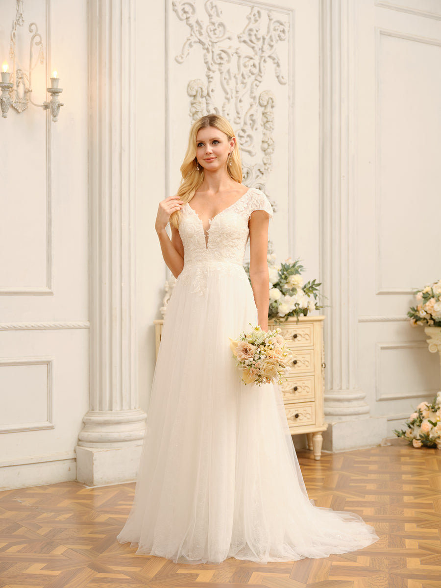 Side profile of the elegant V-neck wedding gown with short sleeves.