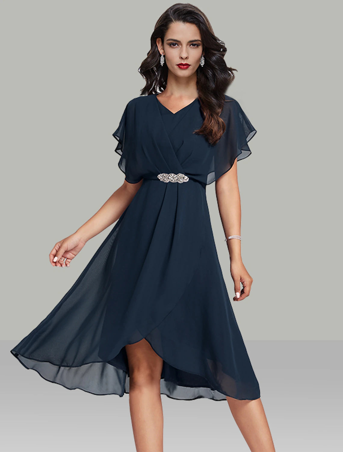 Model wearing an elegant navy A-line midi dress with V-neck, short flutter sleeves, and a beaded waistband.