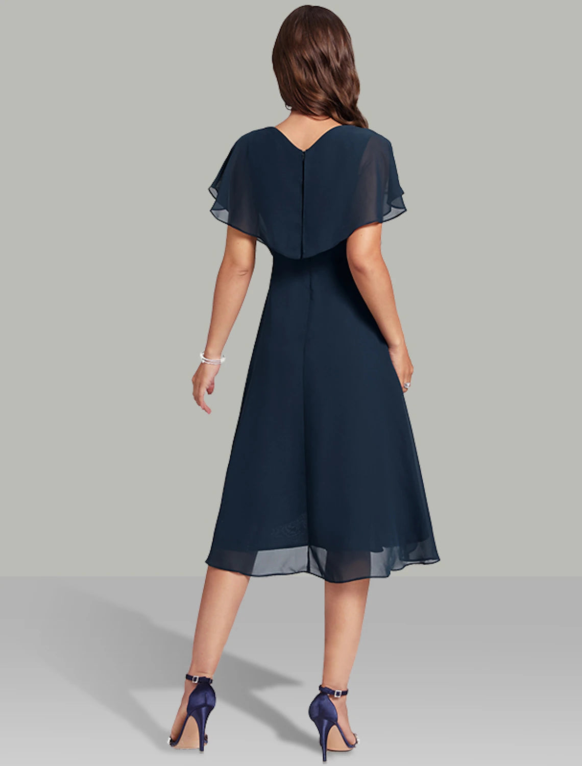 Back view of the navy A-line midi dress, highlighting the elegant silhouette and back zipper closure.