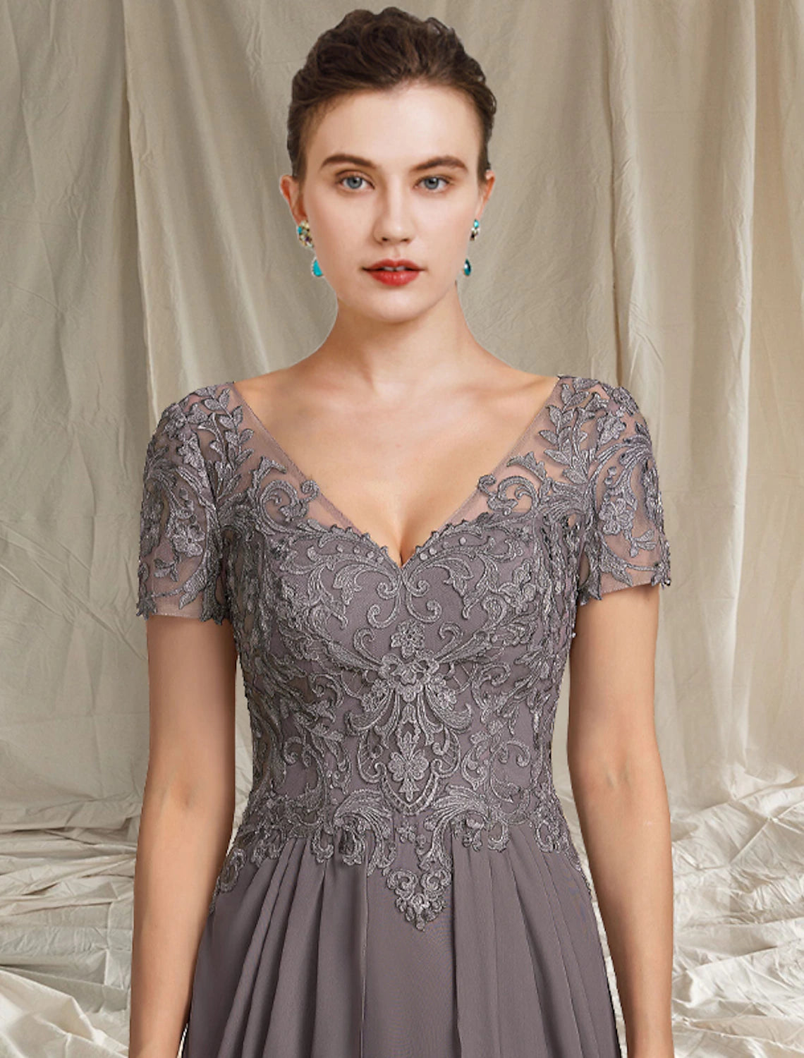 Close-up of the chiffon lace and appliques on the A-line V-neck dress.