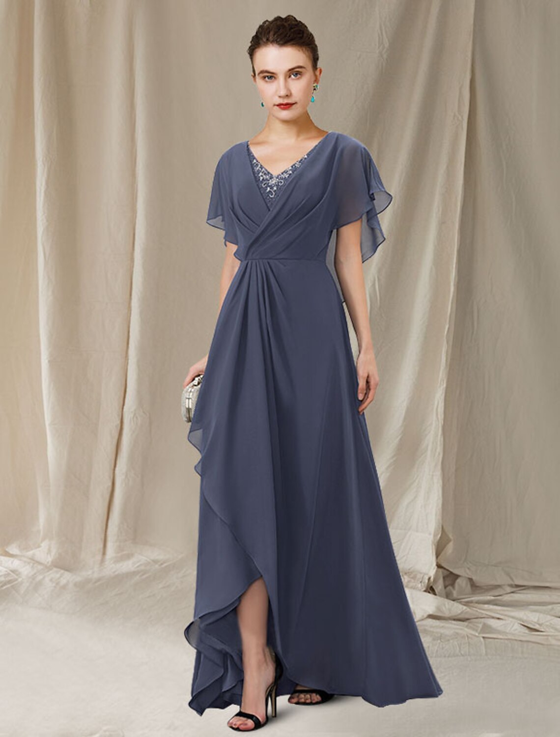Back view of the elegant A-line V-neck short sleeve mother of the bride dress, showing the sweep train and delicate lace.