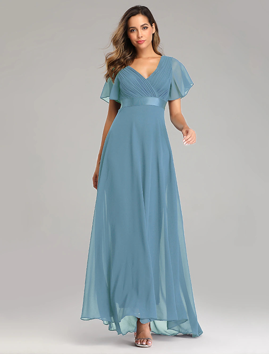 Front view of an elegant red A-line V-neck short sleeve bridesmaid dress with ruched bodice and ruffled skirt.