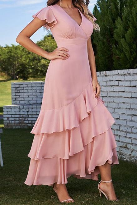 Model posing in a light blue A-line chiffon bridesmaid dress, showcasing the ankle-length design.