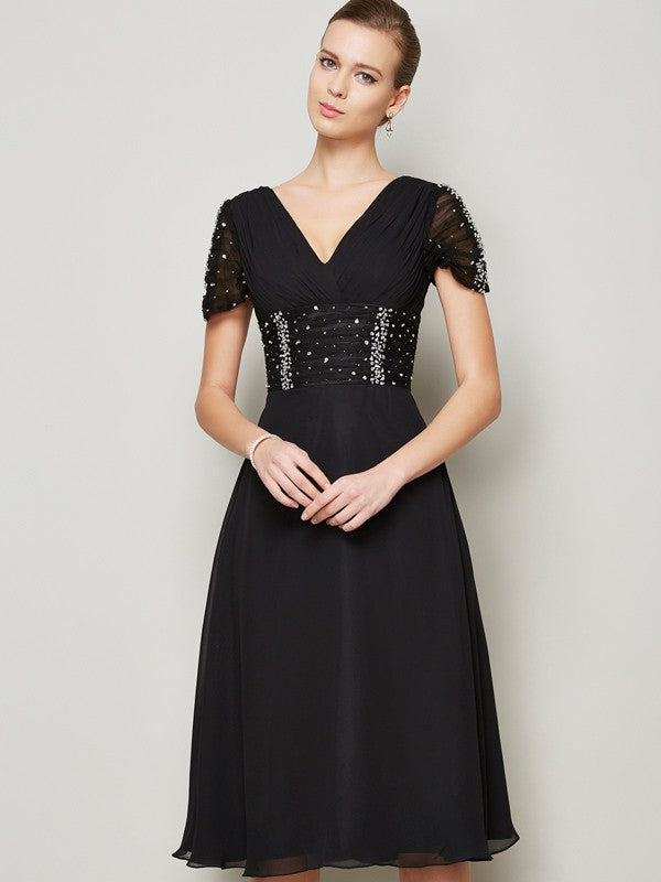 Model wearing a Weitese A-Line V-neck short chiffon homecoming dress with ruffles.