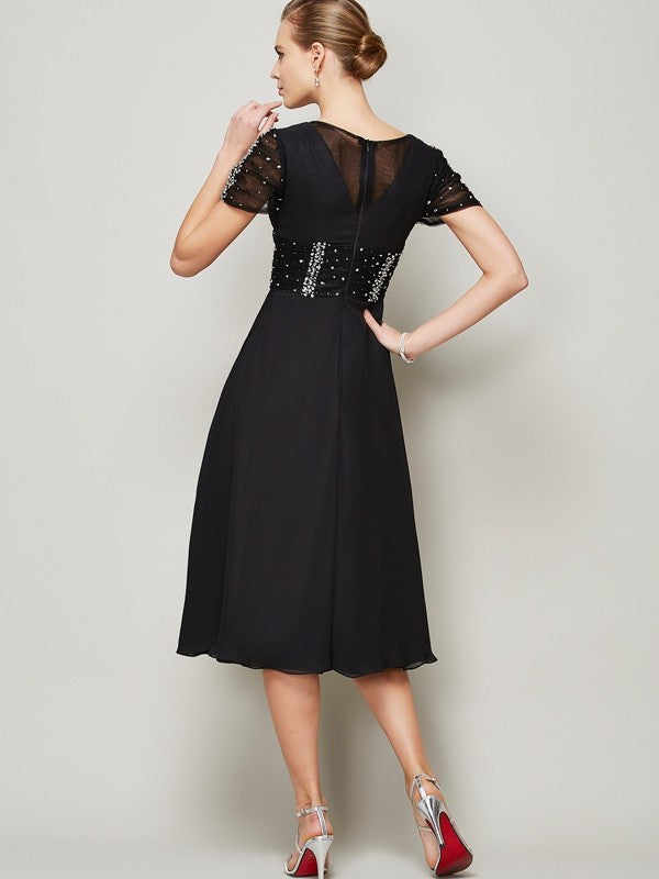 Back view of a model in a Weitese short sleeve ruffled chiffon dress.