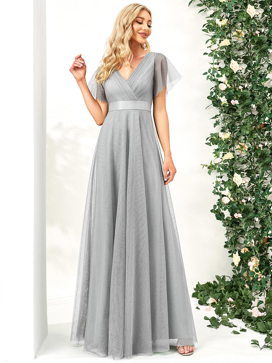 Back view of a grey V-neck tulle bridesmaid dress.