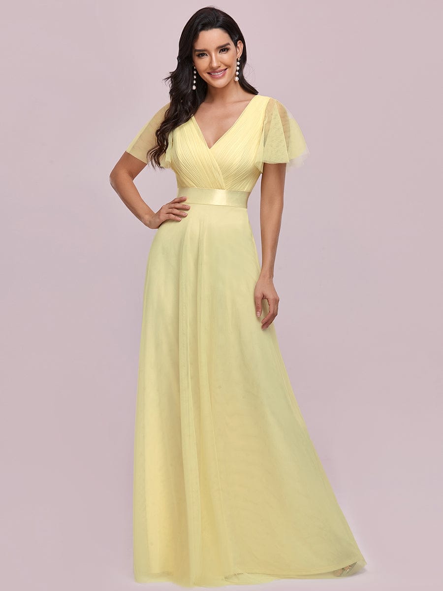 Yellow V-neck short sleeve tulle bridesmaid gown.